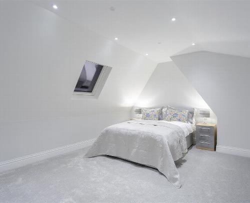 Newly decorated bedroom with white walls